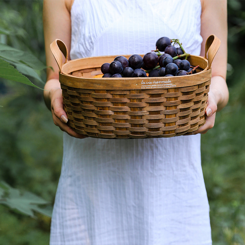 Handwoven Storage Basket with Carbonized Wood Handle
